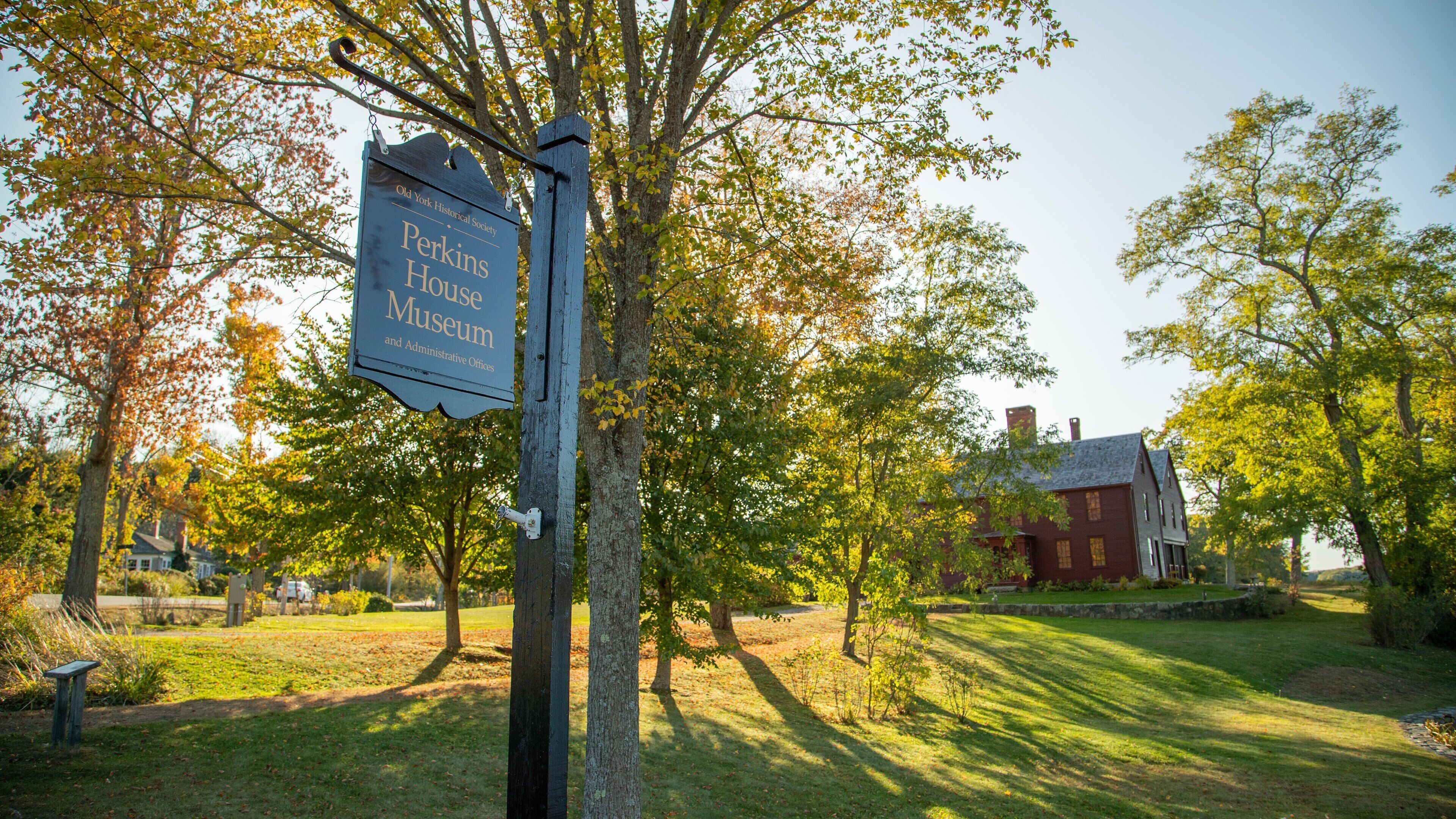 Elizabeth Perkins House featuring signage and a house