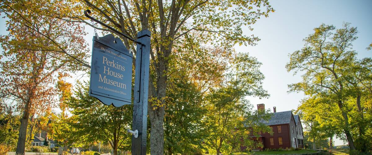 Elizabeth Perkins House featuring signage and a house