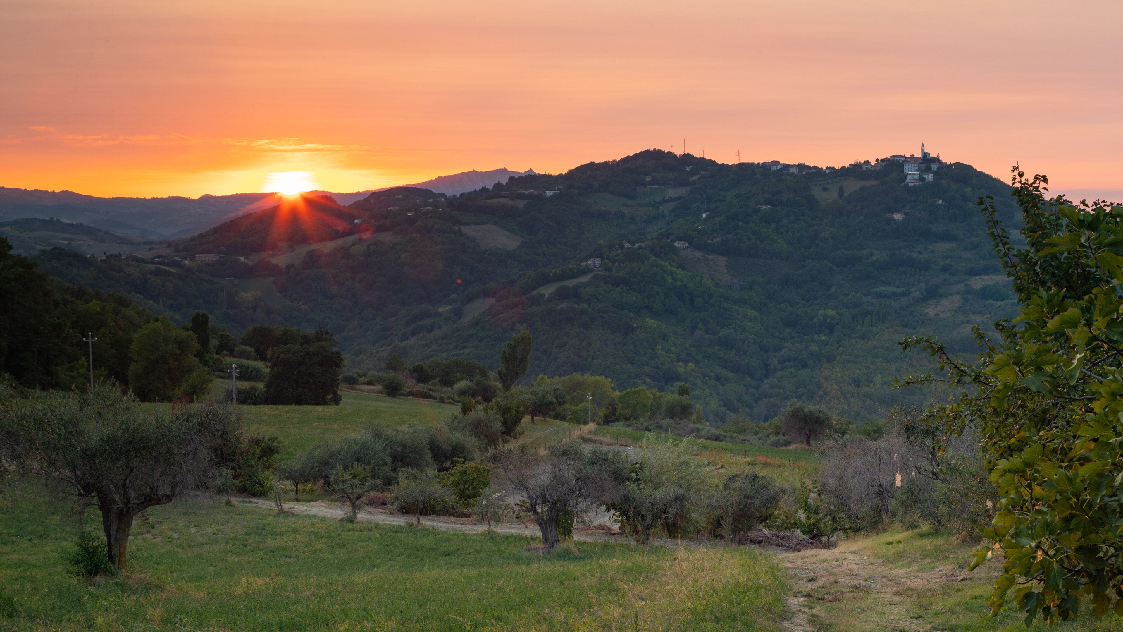 Montefiore Conca showing landscape views, a sunset and tranquil scenes