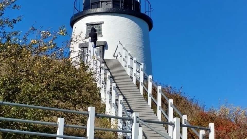 A lighthouse with a spiral staircase leading up to the top.