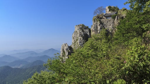 Haenam-gun, Jeollanam-do, South Korea - May 18, 2011: Summer view of green trees and Dosolam Hermitage on rock cliff at Dharma Mountain