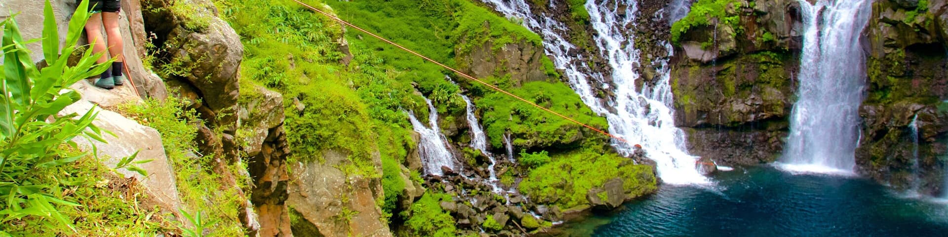 Grand Galet Falls featuring a lake or waterhole, zip lining and a cascade