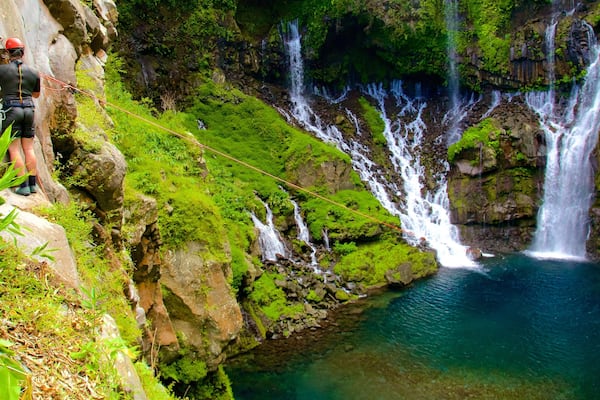Grand Galet Falls featuring a lake or waterhole, zip lining and a cascade