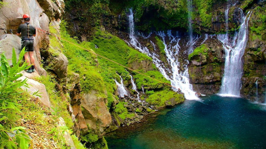 Grand Galet Falls featuring a lake or waterhole, zip lining and a cascade