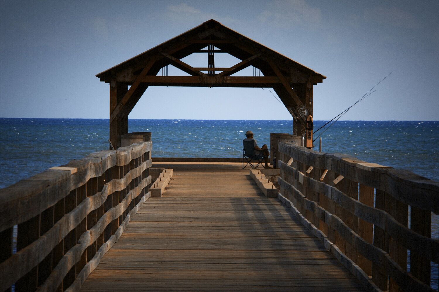 We took an afternoon drive from Poipu out to the Waimea Valley. We stopped in the small town of Waimea on the return trip. I thought this lone fisherman contemplating the South Pacific was worth a snap.