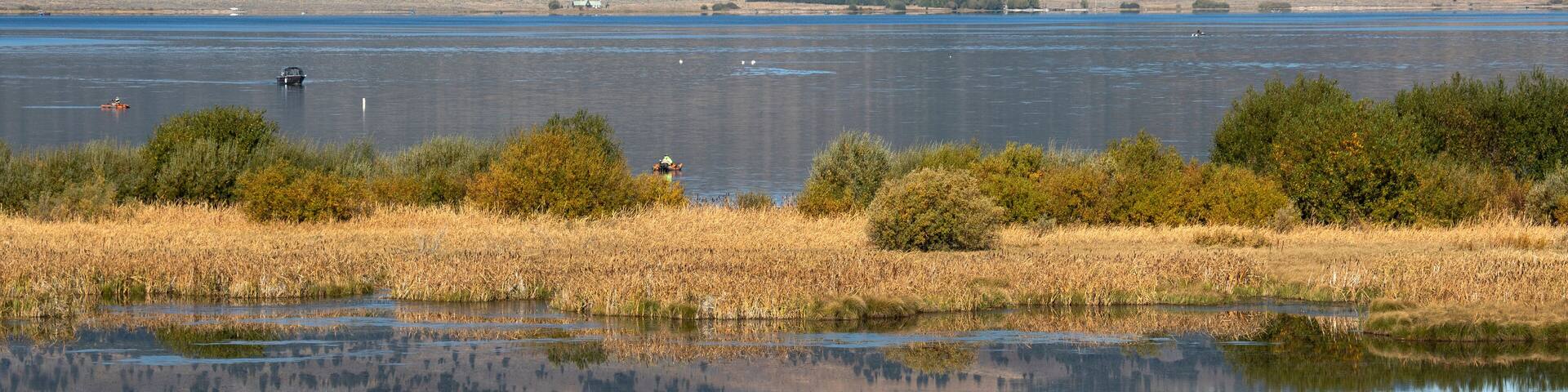 Henry's Lake Idaho beautiful landscape fishing boats. Shallow alpine lake in eastern Idaho. At the Continental Divide near Yellowstone National Park and Island Park. Mountain valley recreation area