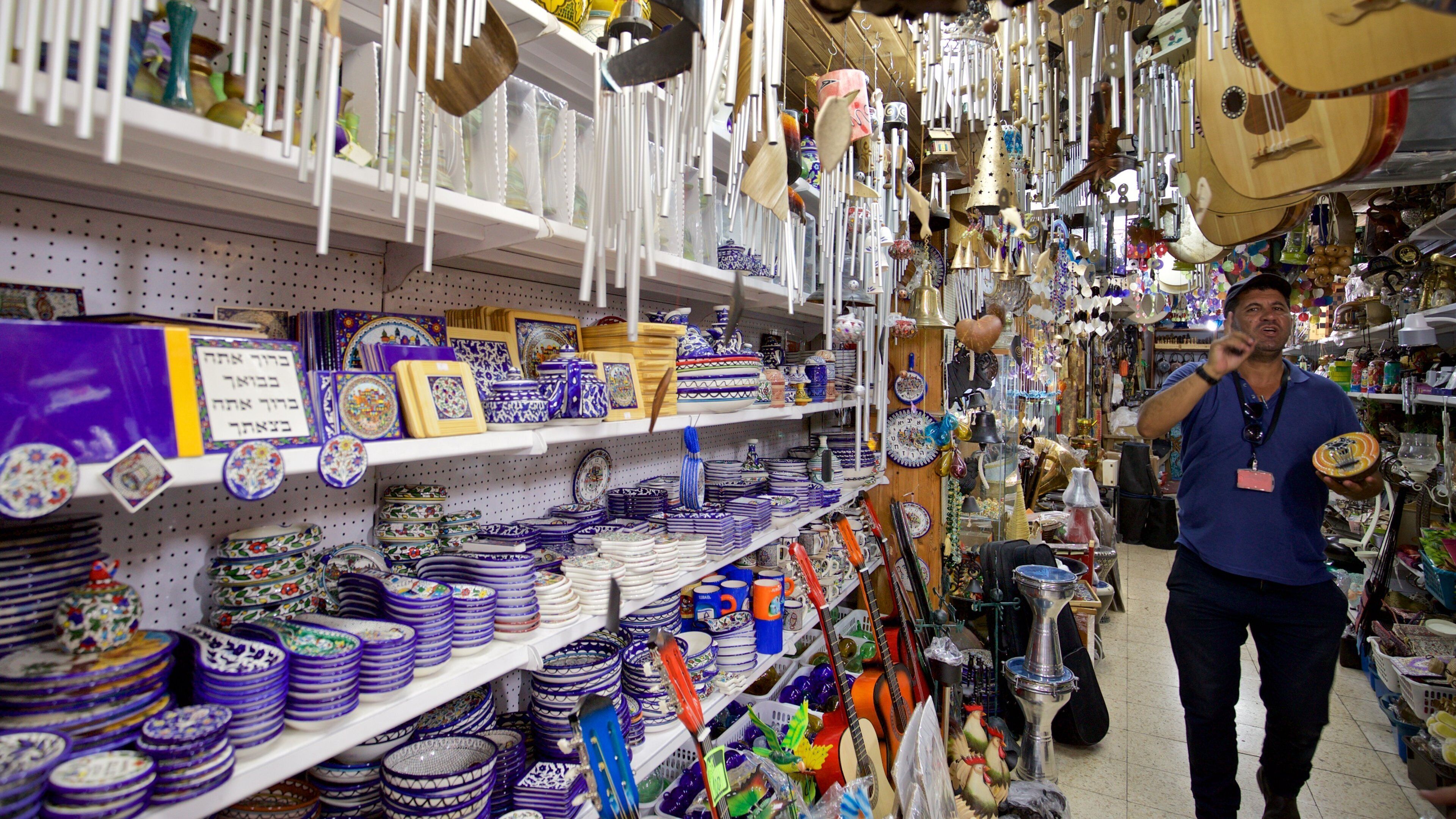 Jaffa Flea Market featuring interior views and markets as well as an individual male