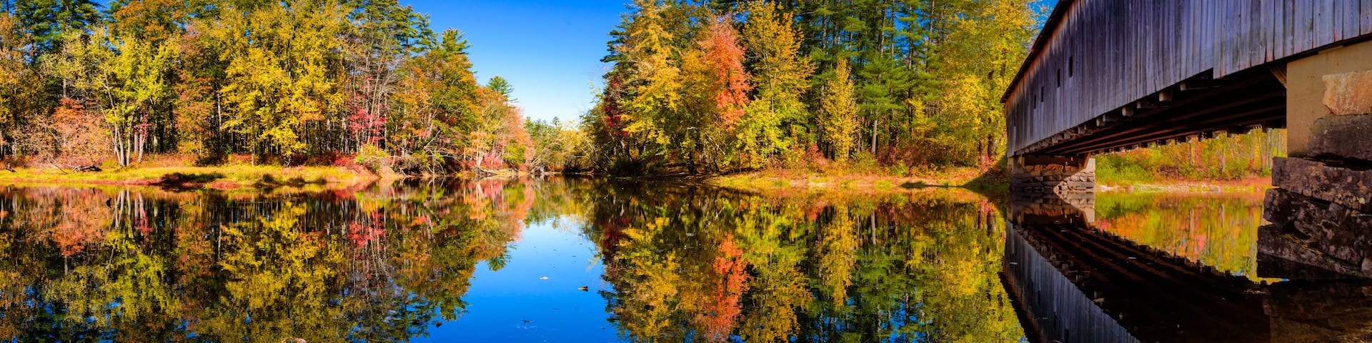 Panoramic view of Saco river and Hemlock bridge at fall