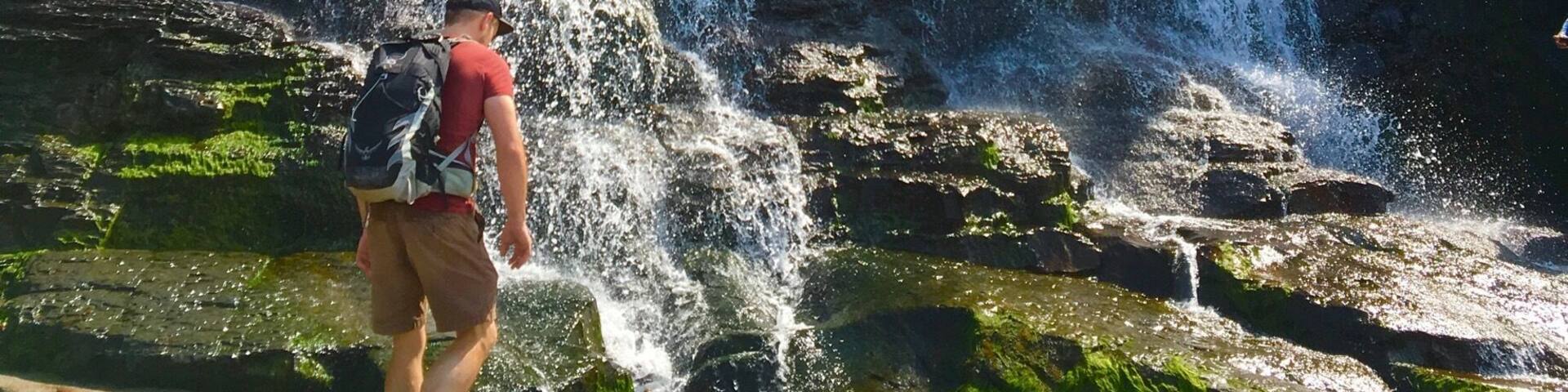 A waterfall cascading down a rocky cliff.