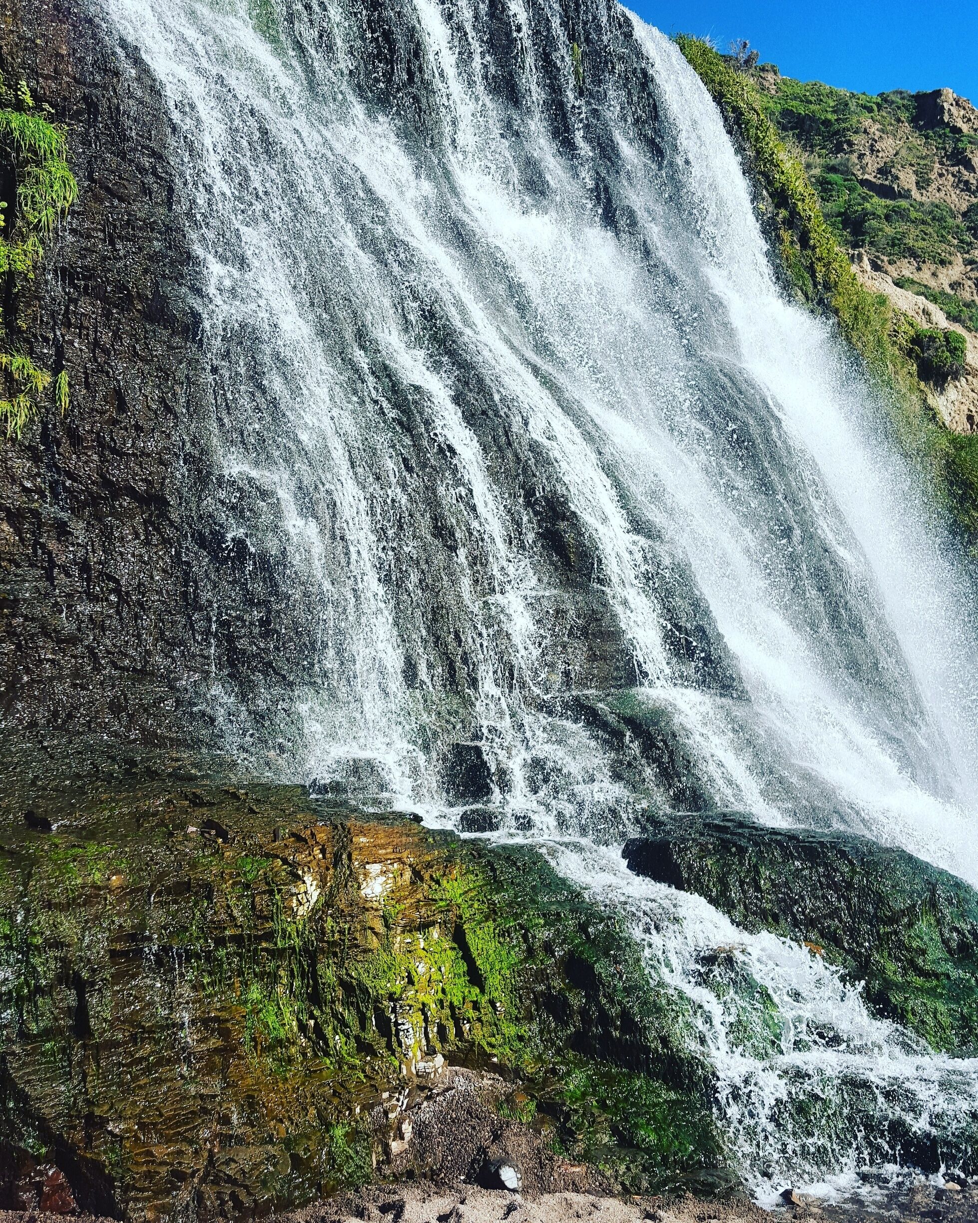 The last of three waterfalls on a secret path that flow into the ocean. 