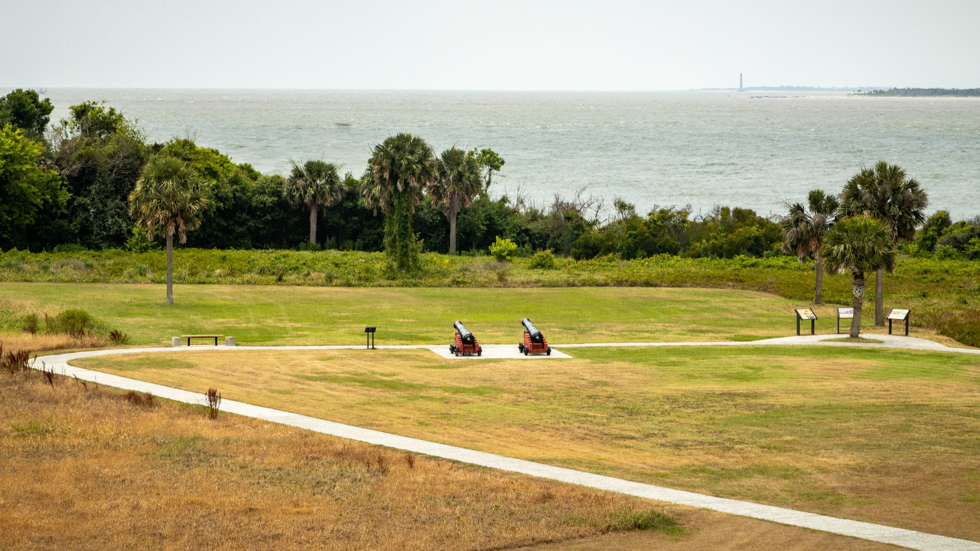 Fort Moultrie showing a park, military items and general coastal views