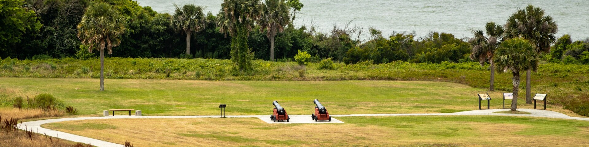 Fort Moultrie showing a park, military items and general coastal views