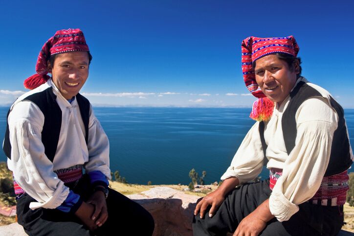Portrait of two young men sitting, Taquile Island, Lake Titicaca, Puno, Peru