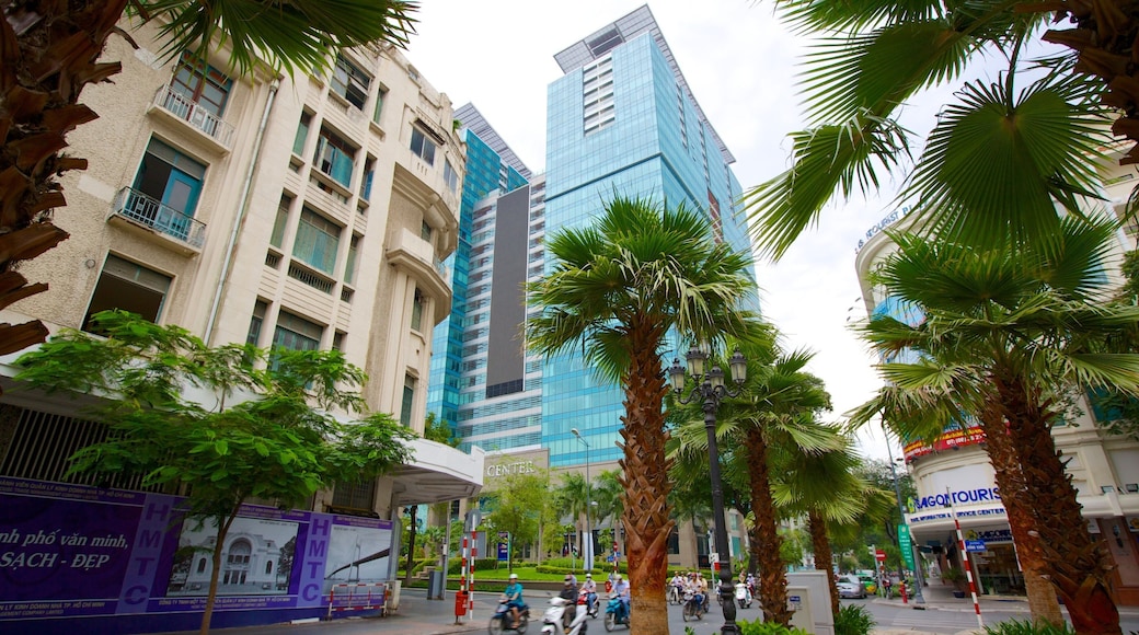Ho Chi Minh Square which includes a high rise building, tropical scenes and street scenes
