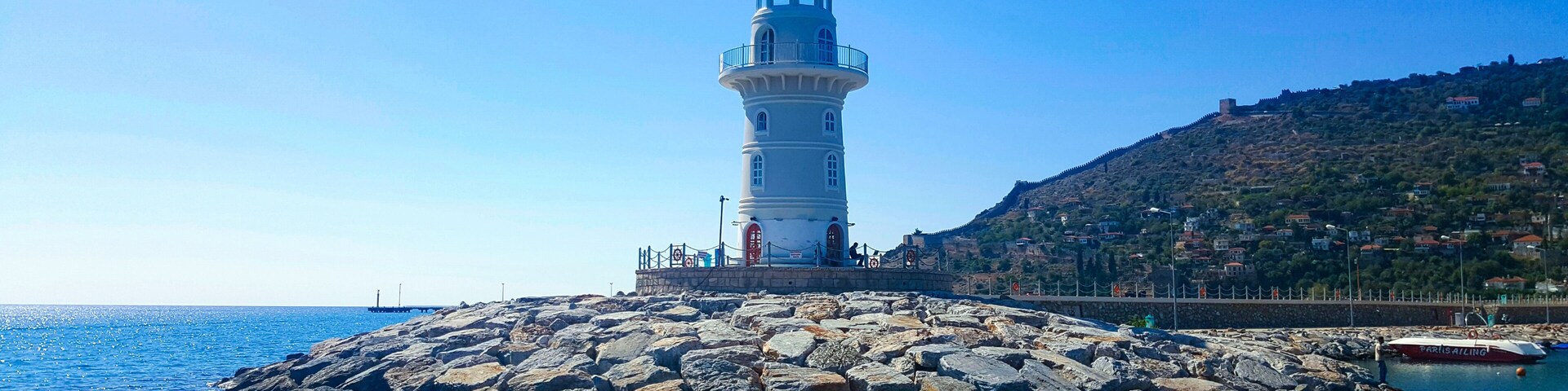 Lighthouse in the port of Alanya. Sea view of the lighthouse in Alanya Turkey.