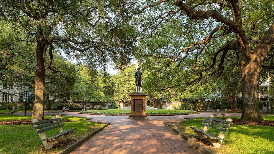 Washington Square featuring a statue or sculpture and a park