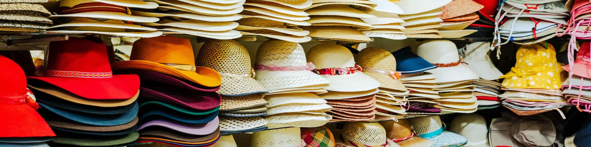 Traditional Arequipenan hats for sale at a stall in the San Camileo central market in Arequipa, Peru. South America.