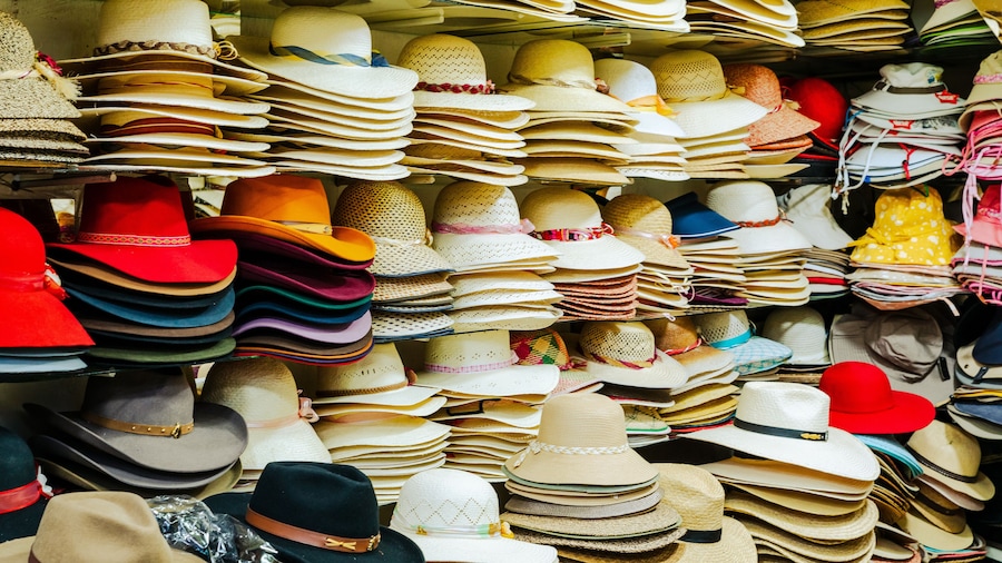 Traditional Arequipenan hats for sale at a stall in the San Camileo central market in Arequipa, Peru. South America.