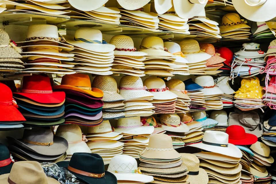A variety of hats displayed in a store.