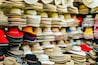 Traditional Arequipenan hats for sale at a stall in the San Camileo central market in Arequipa, Peru. South America.