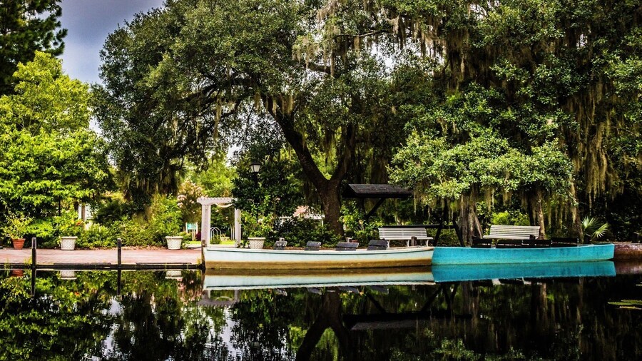 Beautiful calm reflection on Black Water Swamp with thunder storm brewing at #CypressGardensSC #Nature Photo Contest #NaturePhotoContest #MoncksCornerSC #Reflection #Boats #LiveOak