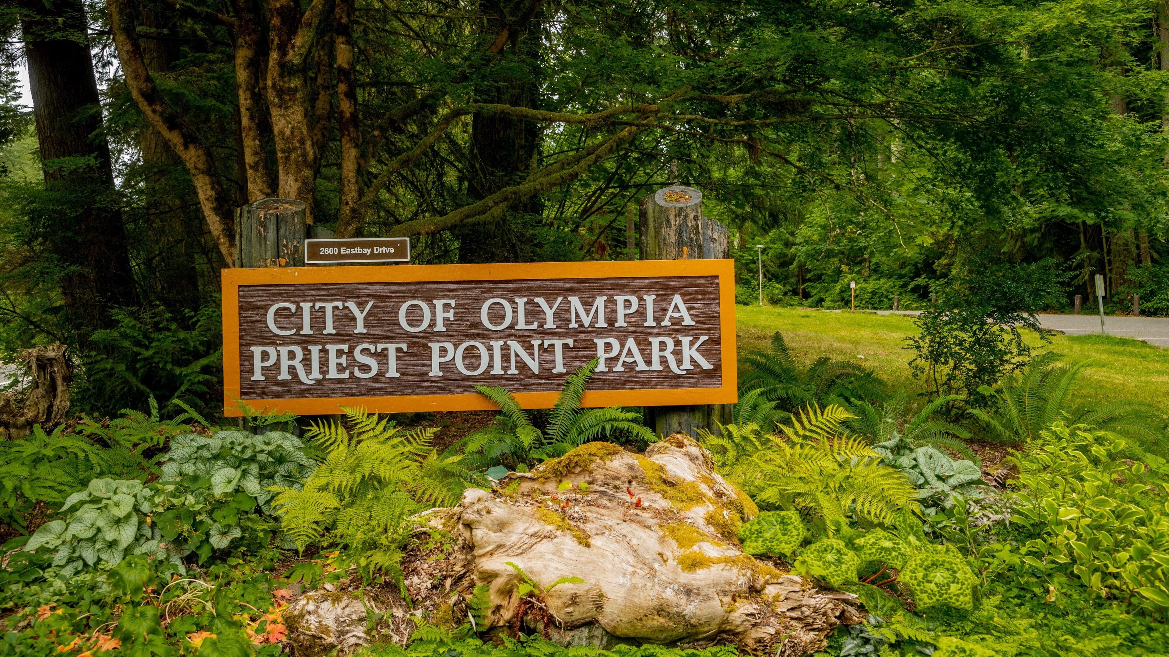 Priest Point Park which includes signage and a park
