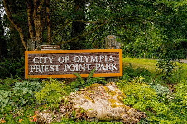 Priest Point Park which includes signage and a park
