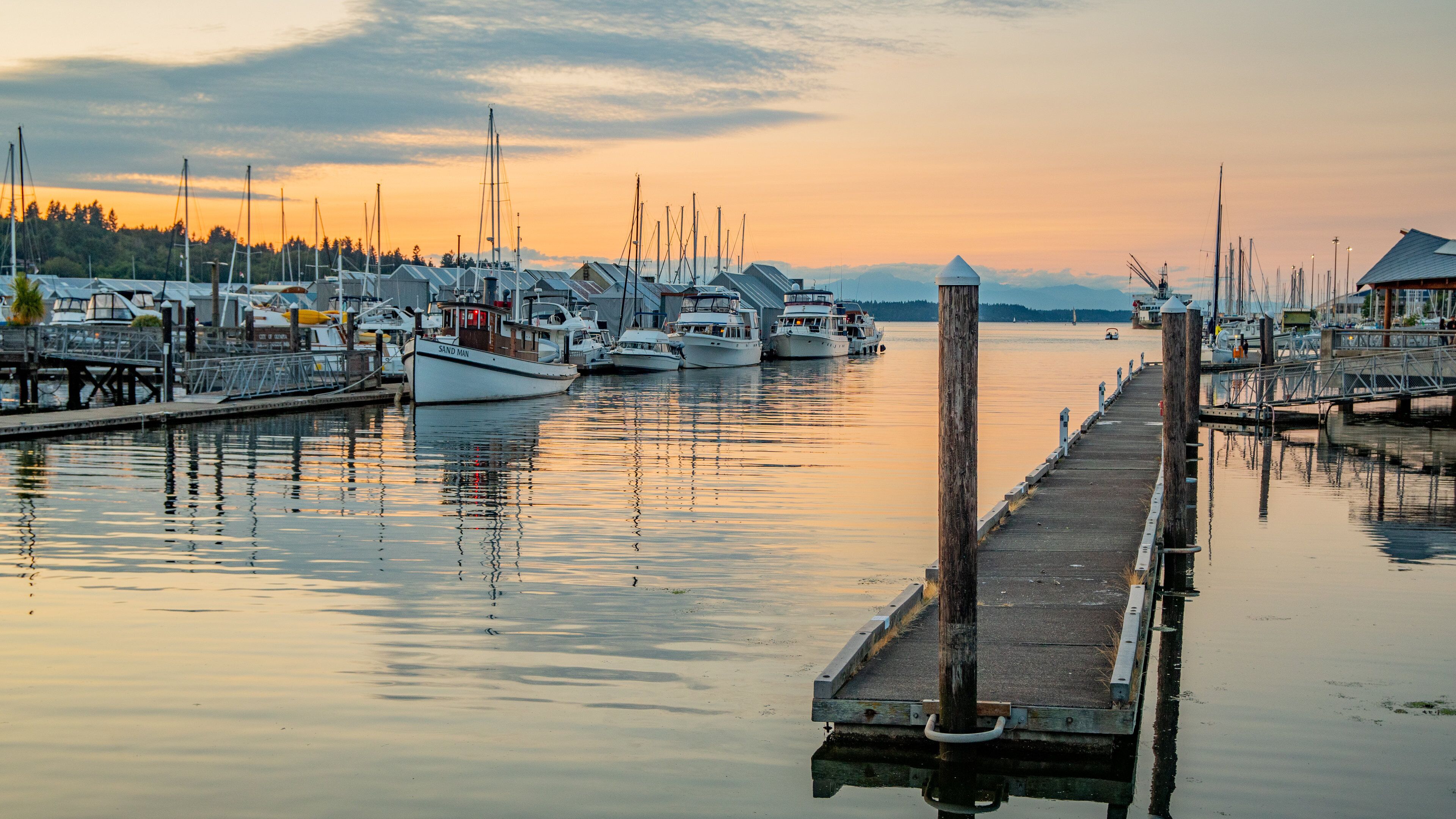 Percival Landing which includes a sunset and a bay or harbor