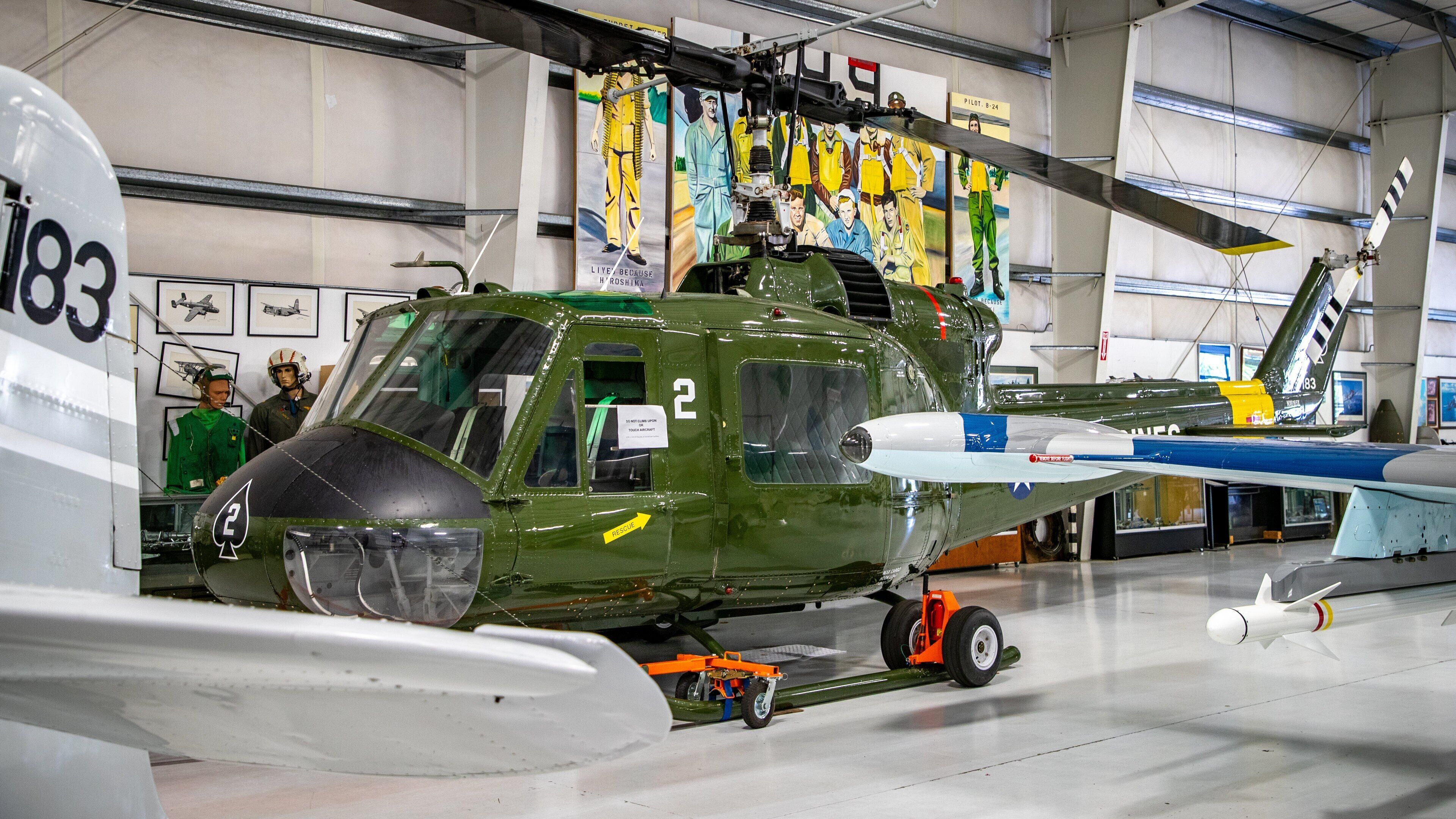 Olympic Flight Museum featuring military items, aircraft and interior views