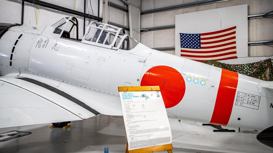 Olympic Flight Museum featuring aircraft, signage and military items
