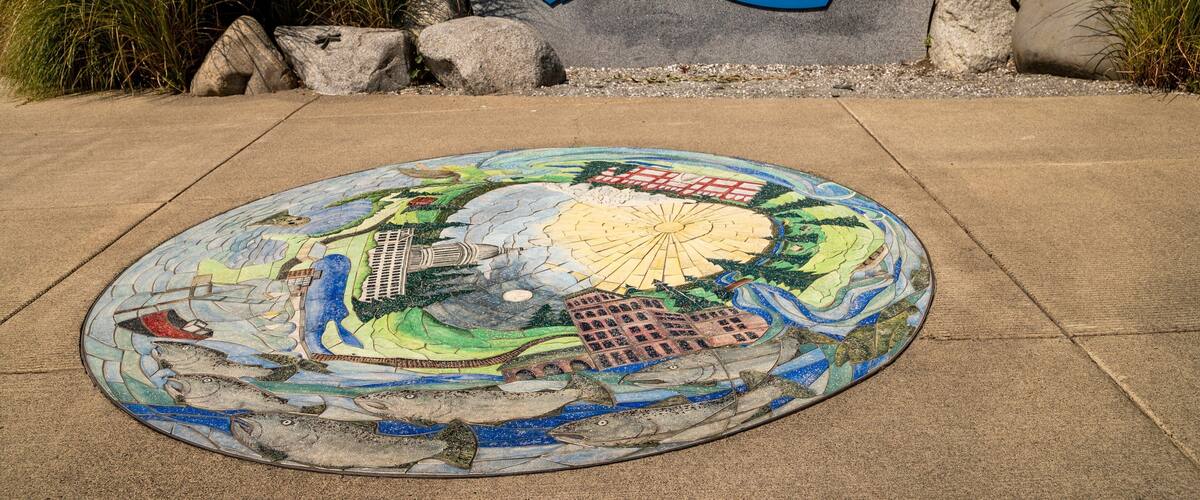 East Bay Public Plaza featuring outdoor art and signage