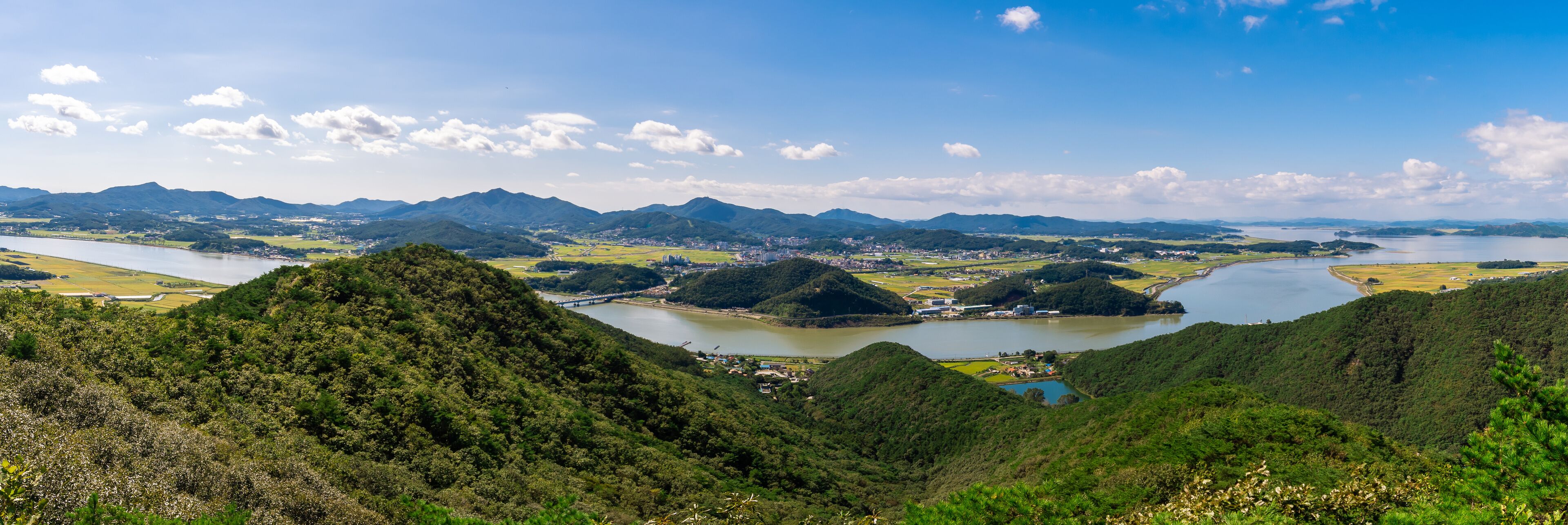 Panoramic view of the valleys of Gimpo, South Korea and the Imjingang River from the top of Munsunsan Mountain. 