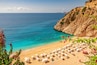 Kaputas beach with blue water on the coast of Antalya region in Turkey with sun umbrellas on the beach