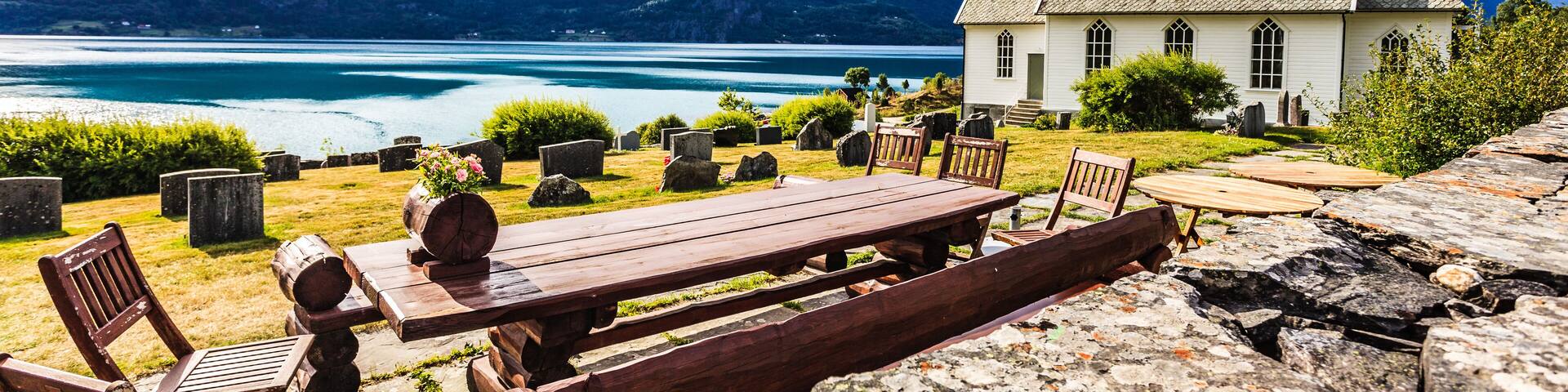 Churchyard in Nes village at fjord, Norway
