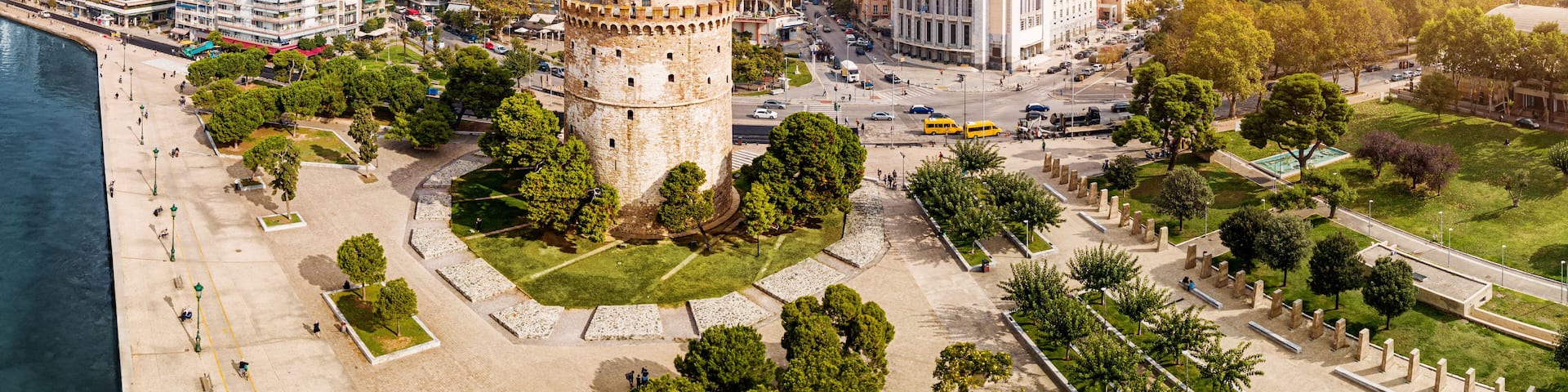Aerial panoramic view of the main symbol of Thessaloniki city and the whole of Macedonia region - the White Tower. Concept of travel and sightseeing attractions in Greece