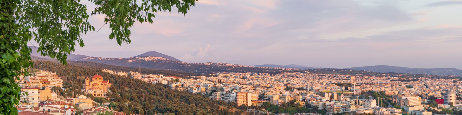 Panoramic View during sunset from old city wall with Saint Paul church Ano Poli Thessaloniki in Central Macedonia in Greece