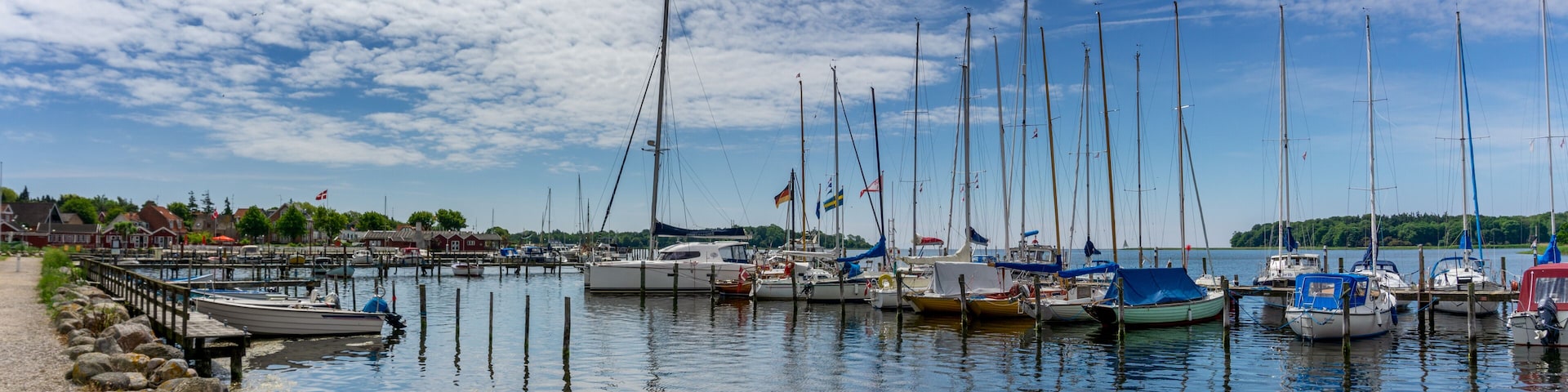 view of the harbor front promenade and marina and yacht harbor in Nysted