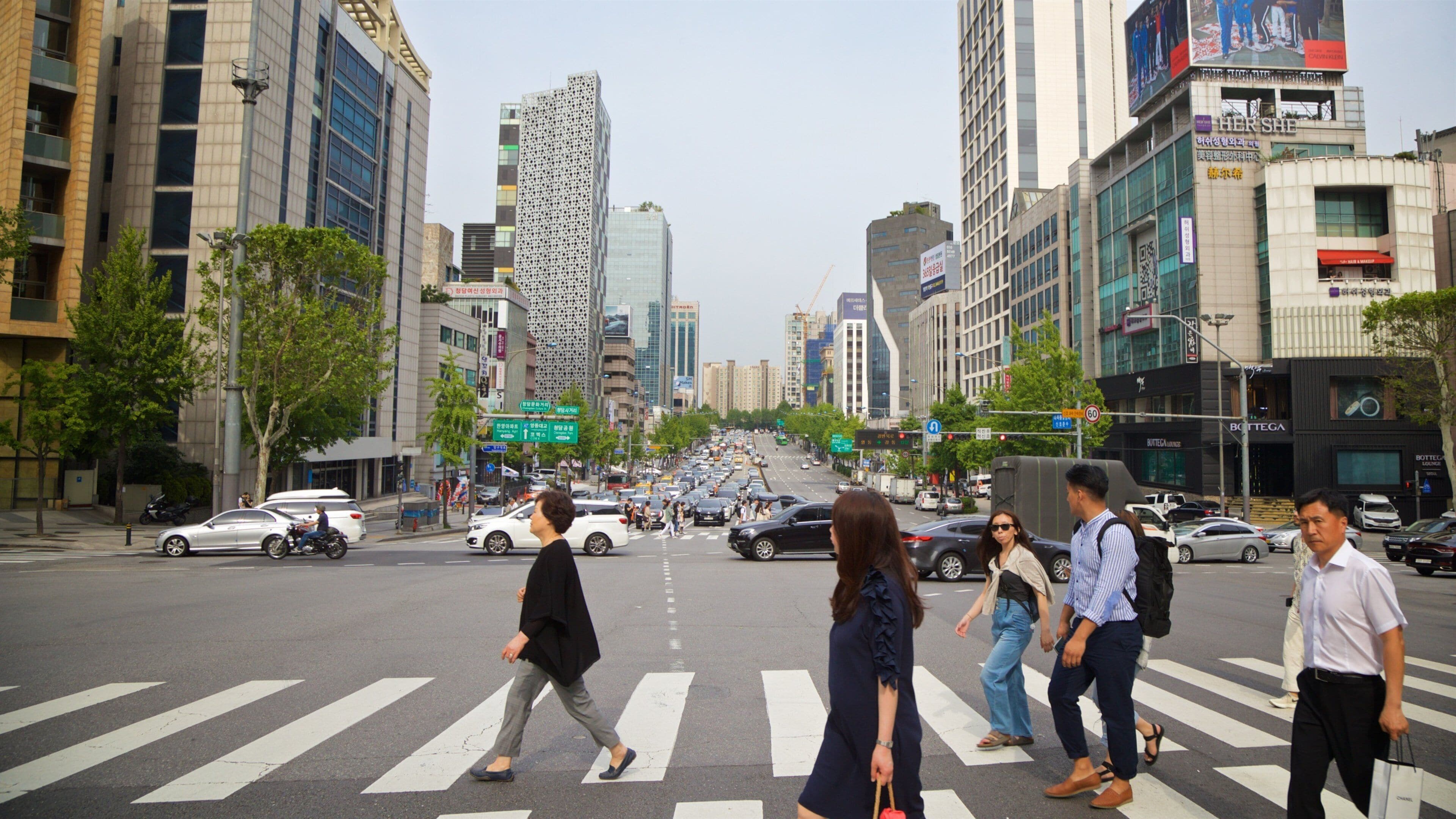Cheongdam showing a city and street scenes as well as a small group of people