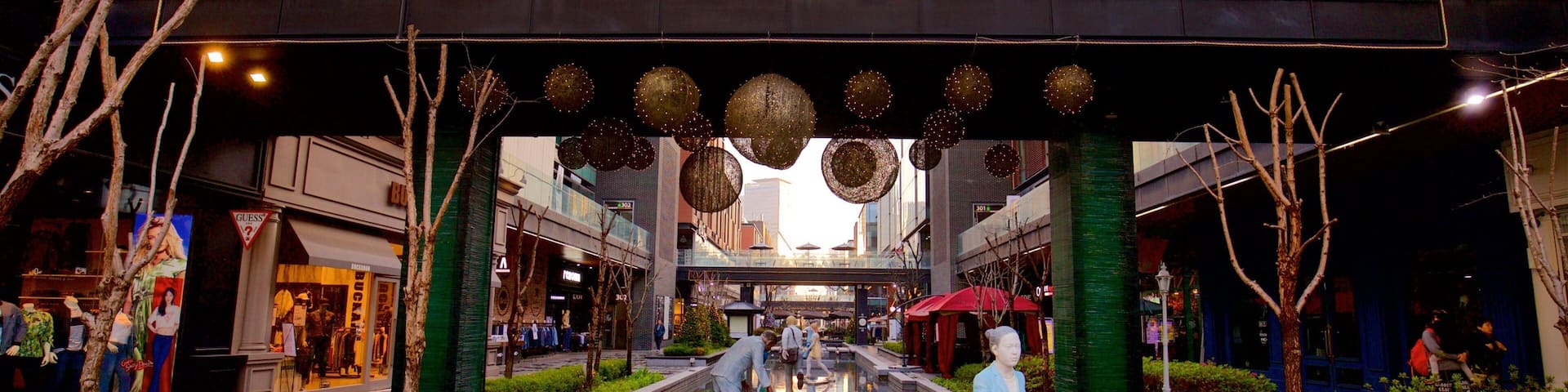 NC Cube Canal Walk featuring a city, outdoor art and a garden