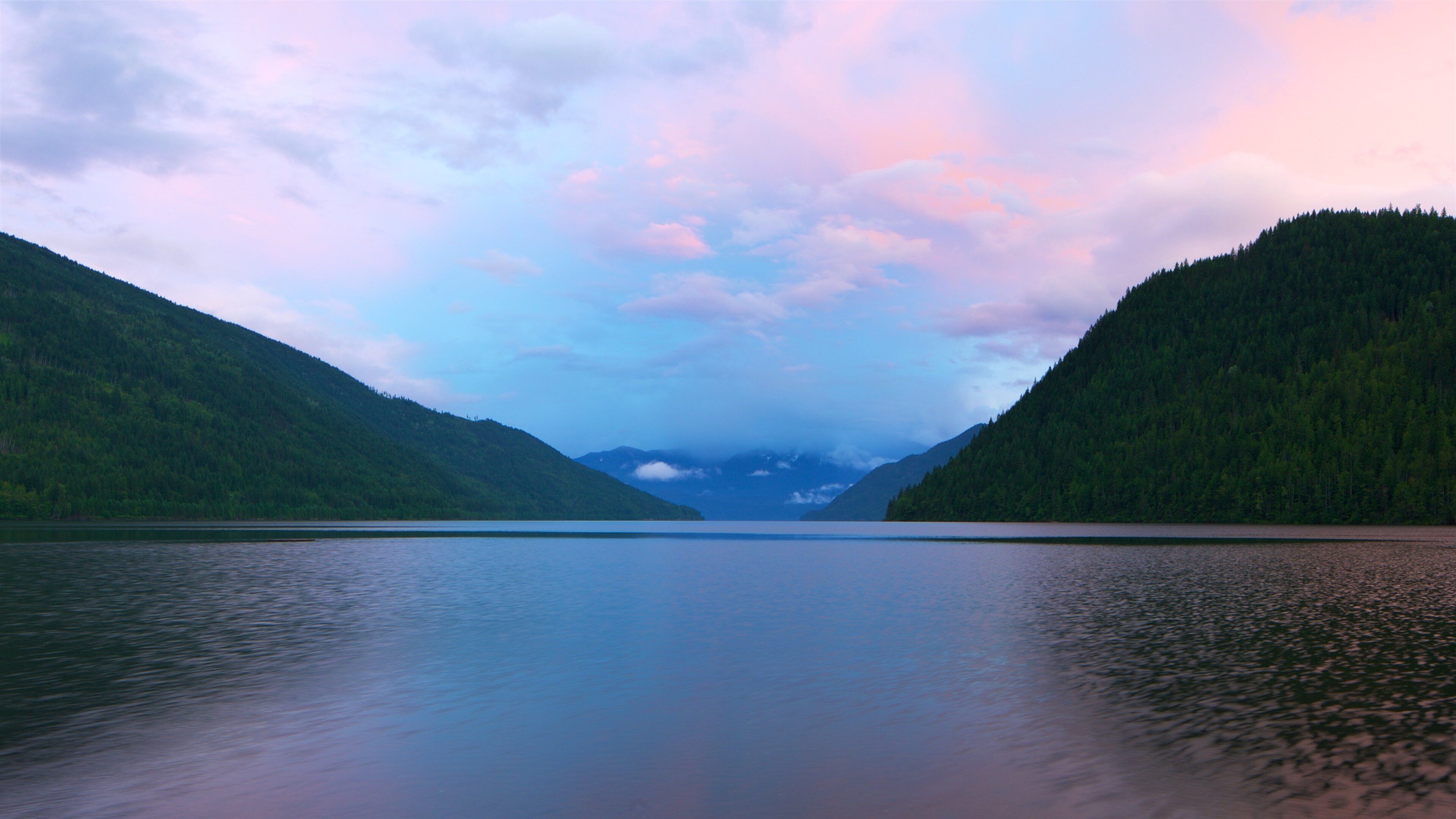 New Denver showing a lake or waterhole and a sunset