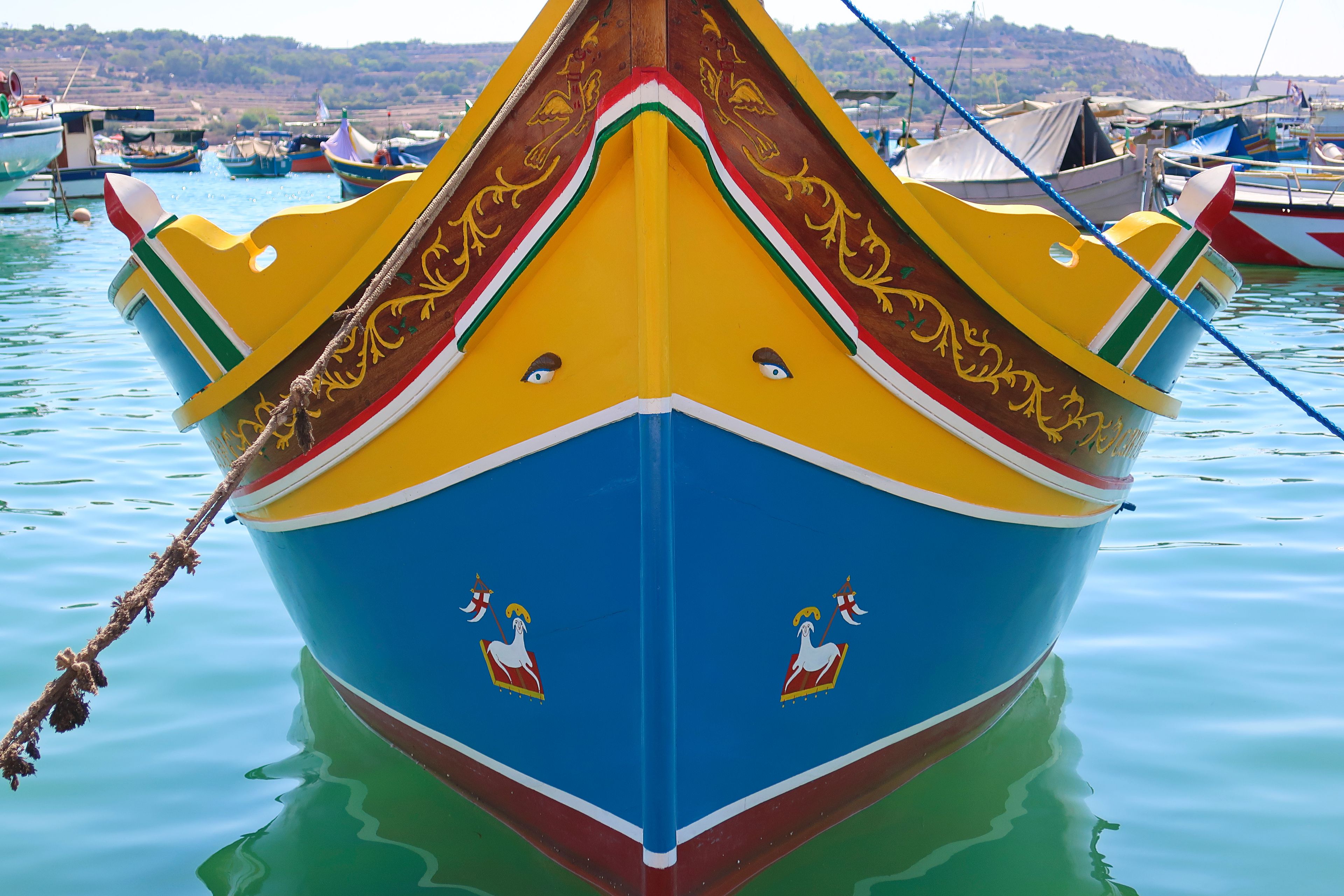 Typical maltese fishing boat, called luzzu with the eye of Osiris, in Marsaxlokk, Malta