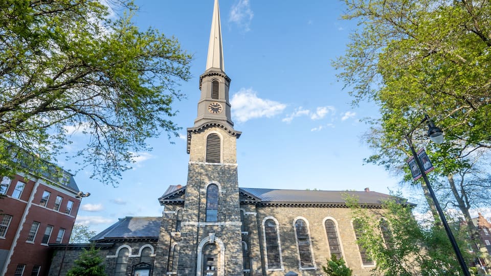 Kingston, NY - USA- May 12, 2021: The Old Dutch Church, a 19th-century bluestone church and cemetery located on Wall Street in the Kingston Stockade District.