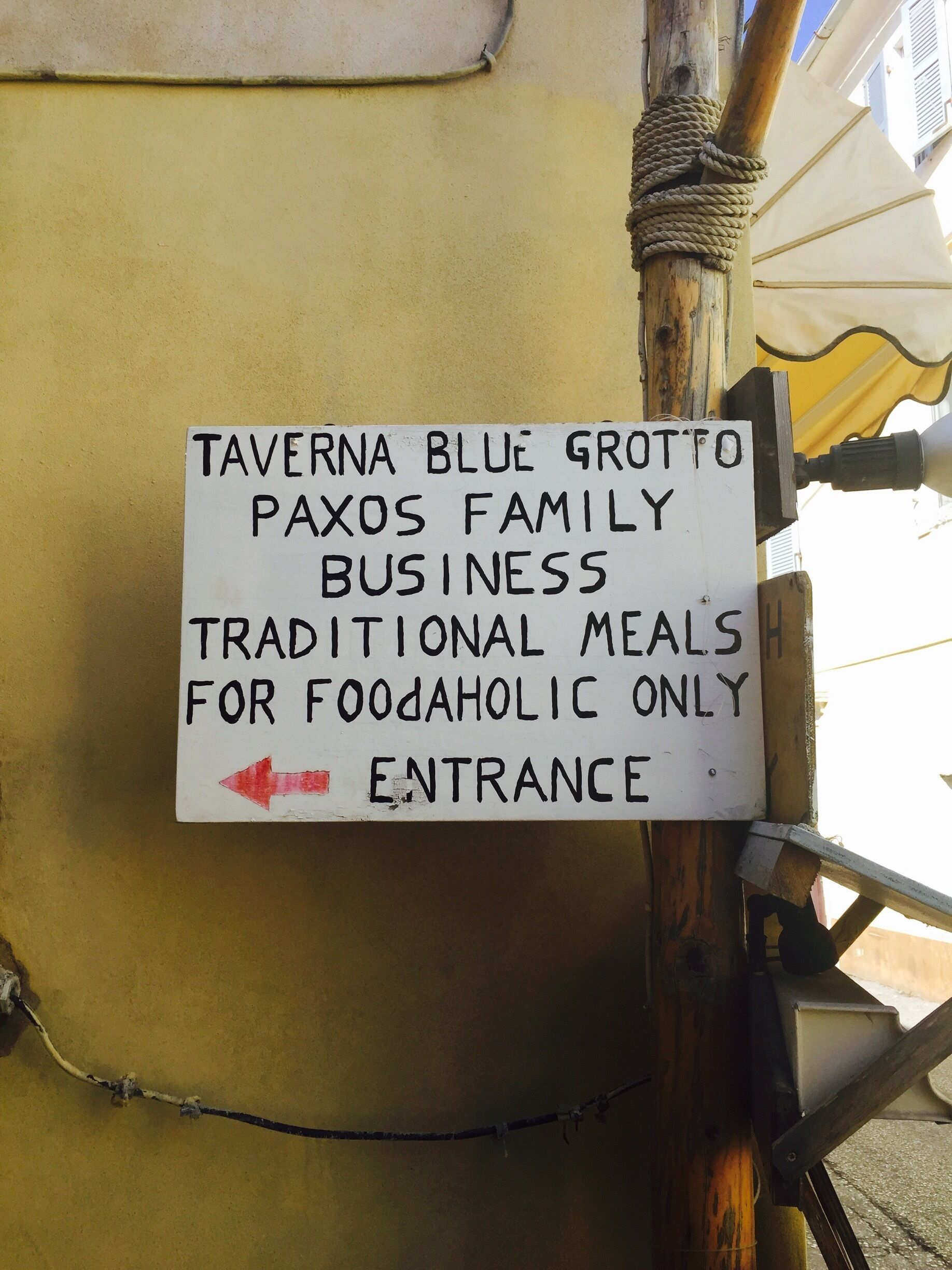 Love this sign. I am definitely a foodaholic 😍🍷🍻🎉 #delicious #paxos #gaios 