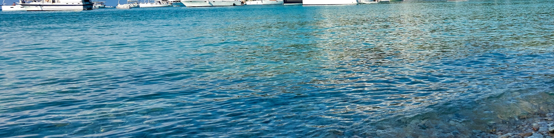 The beautiful Greek island of Paxos, view of Lakka harbour from the shoreline