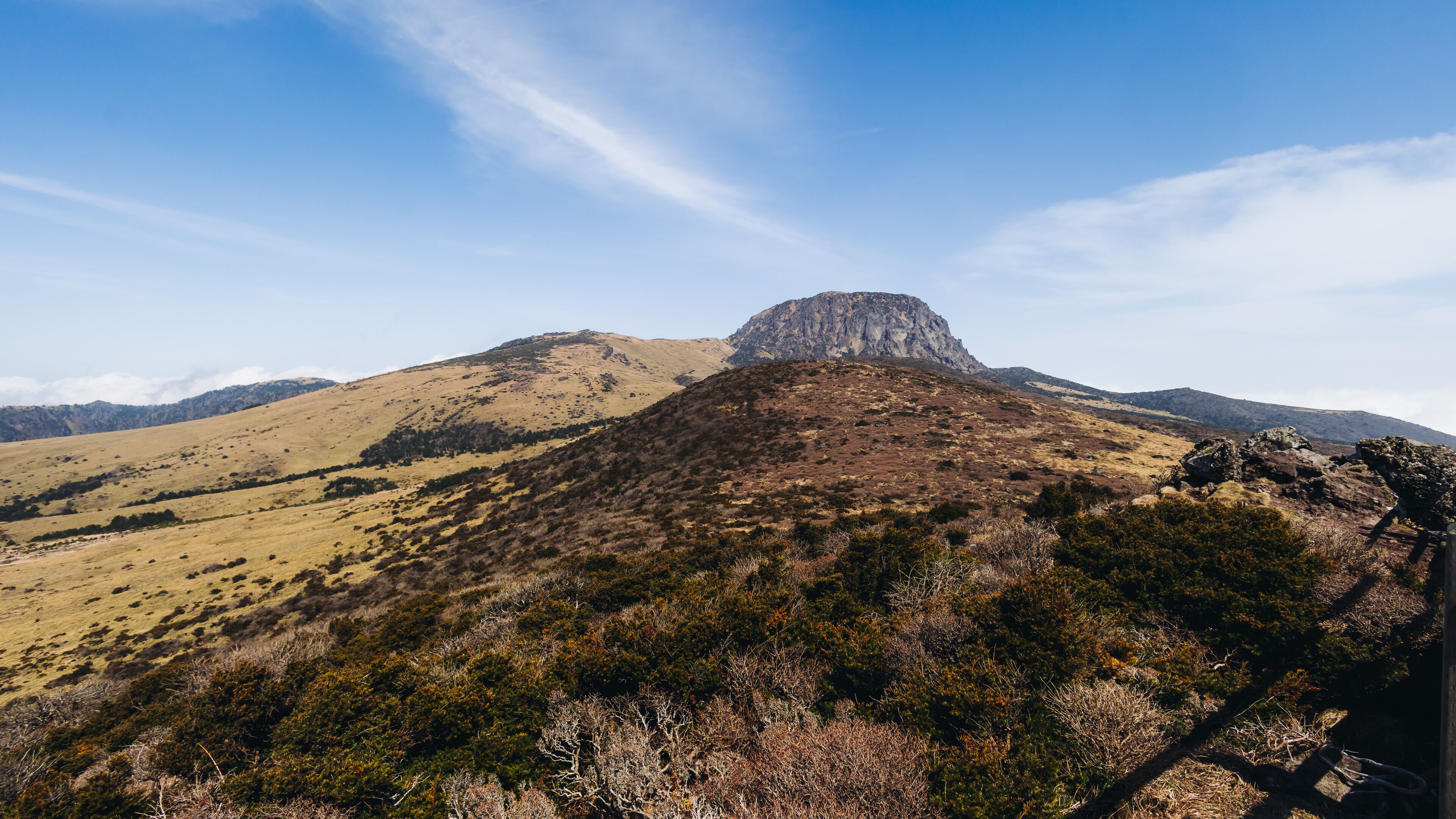 Hallasan National Park, Jeju island, South Korea, spring landscape view of Yeongsil trail, Halla volcano peak, trekking and climbing to Halla mountain, travel and hiking in Korea, Jeju-do, sunny day
