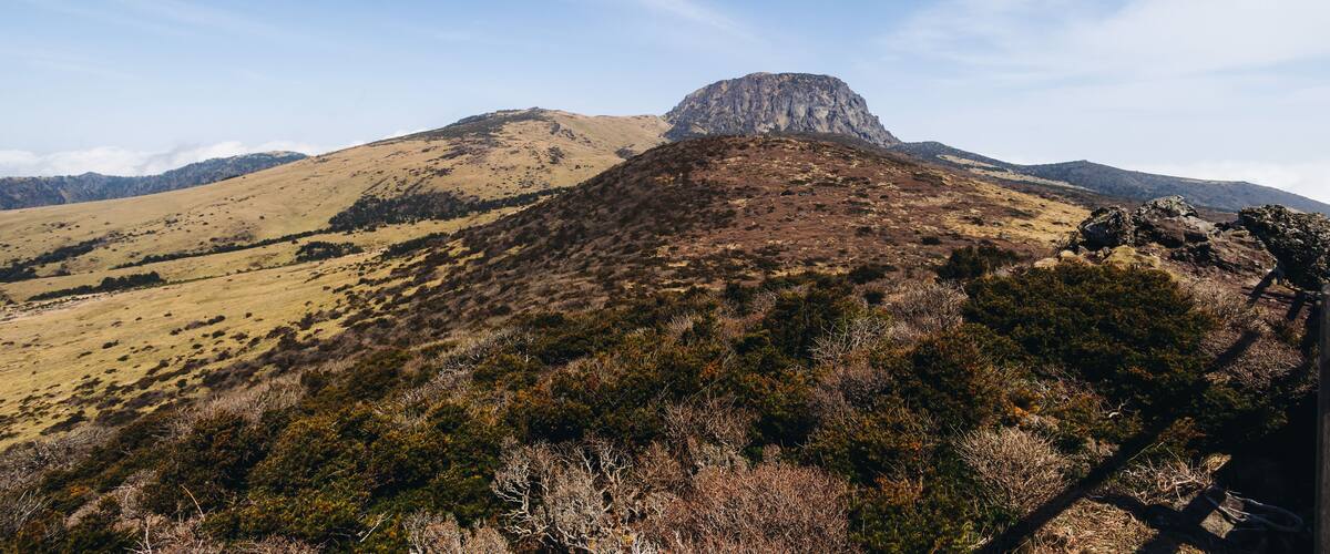 Hallasan National Park, Jeju island, South Korea, spring landscape view of Yeongsil trail, Halla volcano peak, trekking and climbing to Halla mountain, travel and hiking in Korea, Jeju-do, sunny day