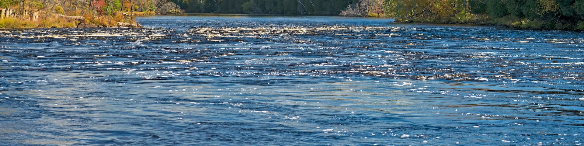North Woods River Flowing into the Fall Colors
