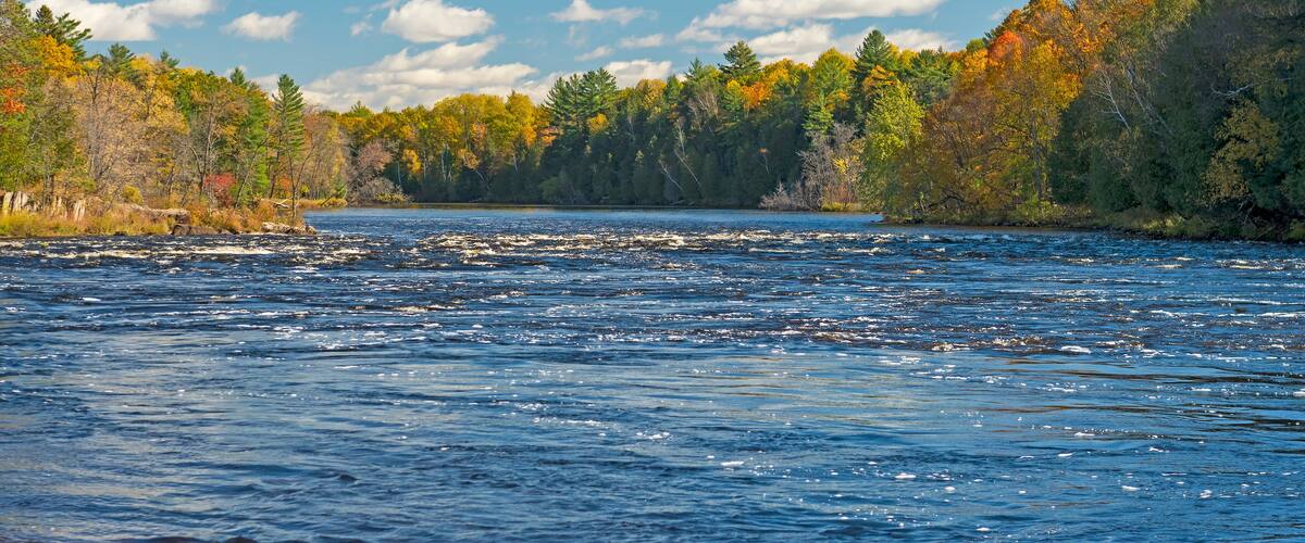 North Woods River Flowing into the Fall Colors