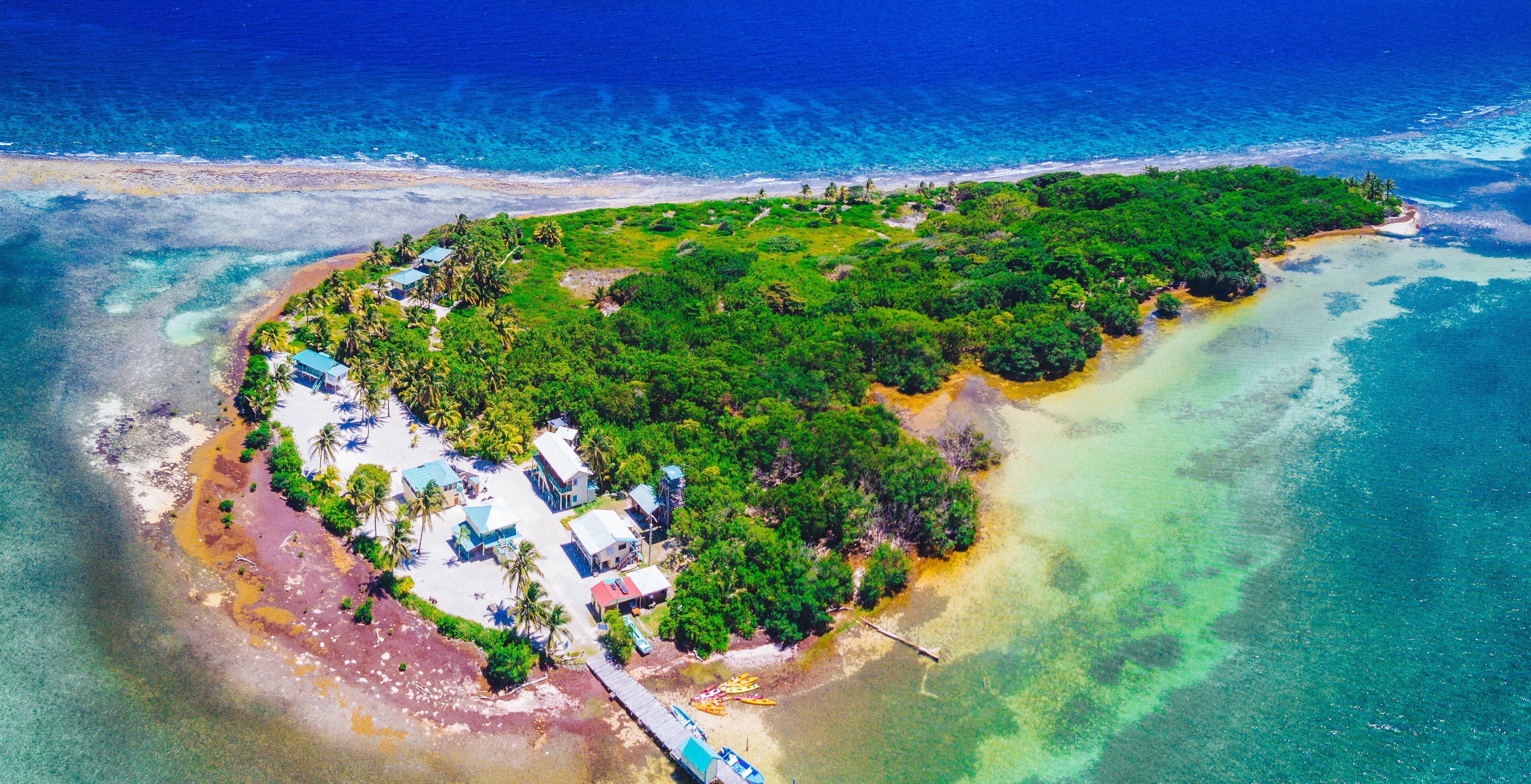 Aerial view of tropical island at Glover's Reef Atoll in Belize Barrier Reef
