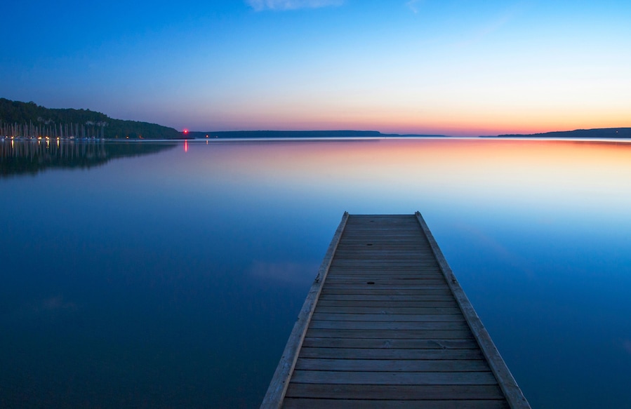 Wooden dock over still lake